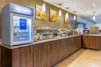 a restaurant with a counter with a foodcourt with food at Comfort Inn Lancaster at Rockvale in Lancaster