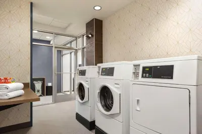 a laundry room with two washer and dryer at Home2 Suites By Hilton York in York