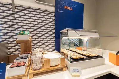 a display case with donuts and other pastries at Holiday Inn Express Hotel & Suites Lebanon by IHG in Lebanon