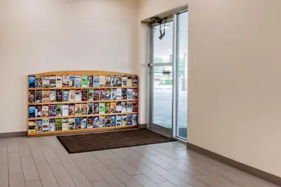 a room with a book shelf next to a door at Escape Inn Hershey in Hershey