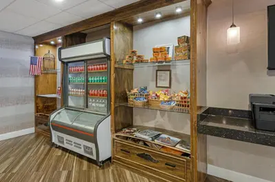 a refrigerator in a kitchen with food in it at Best Western Hunt's Landing Hotel Matamoras Milford in Matamoras