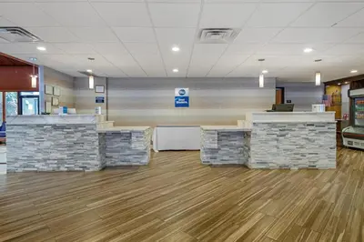 an empty lobby of a hospital with reception desks at Best Western Hunt's Landing Hotel Matamoras Milford in Matamoras