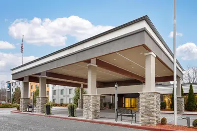 a building with awning on a street at Best Western Hunt's Landing Hotel Matamoras Milford in Matamoras