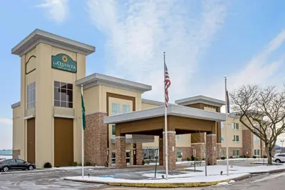 a building with an american flag in front of it at La Quinta by Wyndham York in York