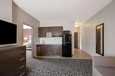 a kitchen with a black refrigerator and a sink at La Quinta by Wyndham York in York