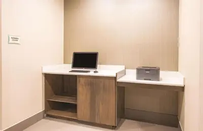 a laptop computer sitting on a desk in a room at La Quinta by Wyndham York in York