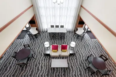 an overhead view of a dining room with chairs and tables at Staybridge Suites Harrisburg-Hershey by IHG in Harrisburg