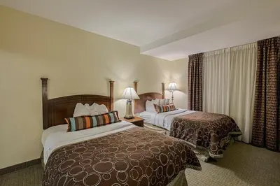 a hotel room with two beds and two lamps at Staybridge Suites Harrisburg-Hershey by IHG in Harrisburg