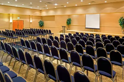 an empty auditorium with chairs and a whiteboard at Red Lion Hotel Harrisburg Hershey in Harrisburg