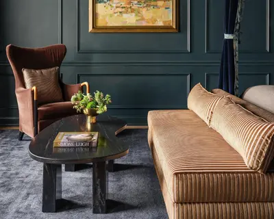 a living room with a couch and a coffee table at The Bellevue Hotel, in the Unbound Collection by Hyatt in Philadelphia