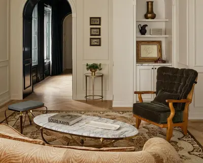 a living room with a chair and a coffee table at The Bellevue Hotel, in the Unbound Collection by Hyatt in Philadelphia