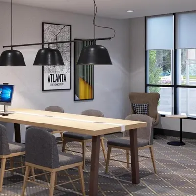 a conference room with a wooden table and chairs at Holiday Inn Lansdale-Hatfield by IHG in Kulpsville