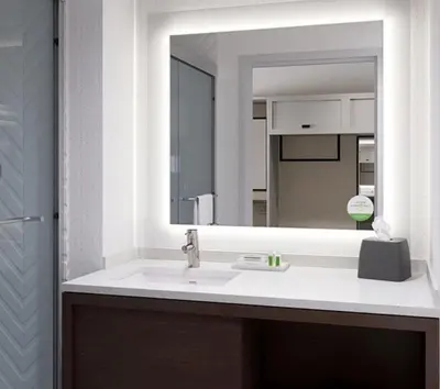 a bathroom with a sink and a mirror at Holiday Inn Lansdale-Hatfield by IHG in Kulpsville