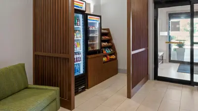 a room with a refrigerator with drinks in it at Holiday Inn Express Hotel & Suites Newton Sparta by IHG in Newton