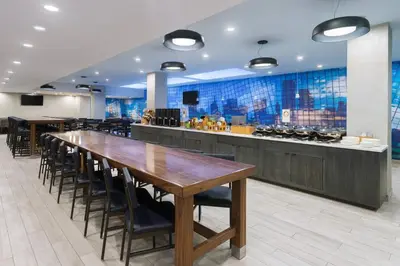 a large dining room with a long table and chairs at Fairfield Inn & Suites by Marriott New York Manhattan/Central Park in New York