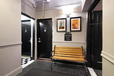 a hallway with a wooden bench in a building at Hotel 309 in New York