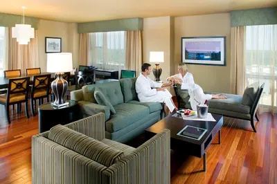 a group of people sitting in a living room at Heldrich Hotel and Conference Center in New Brunswick