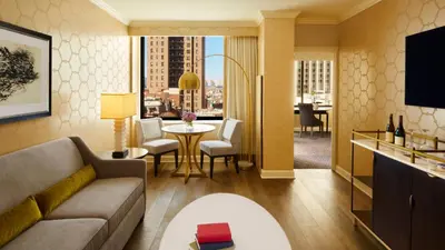 a living room with a couch and a table at The Rittenhouse Hotel in Philadelphia