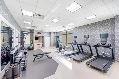 a gym with several treadmills and cardio machines at Homewood Suites by Hilton East Rutherford - Meadowlands, NJ in East Rutherford