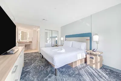 a bedroom with a large bed and a television at Homewood Suites by Hilton East Rutherford - Meadowlands, NJ in East Rutherford