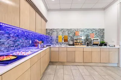 a kitchen with a counter with food on it at Homewood Suites by Hilton East Rutherford - Meadowlands, NJ in East Rutherford