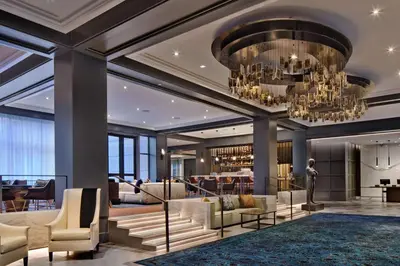 a lobby of a hotel with a chandelier at The Logan Philadelphia, Curio Collection by Hilton in Philadelphia
