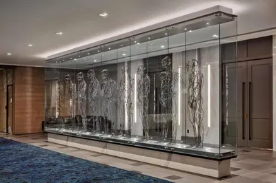 a display case in a building with a bunch of dresses at The Logan Philadelphia, Curio Collection by Hilton in Philadelphia