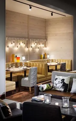 a restaurant with couches and tables and chairs at The Logan Philadelphia, Curio Collection by Hilton in Philadelphia