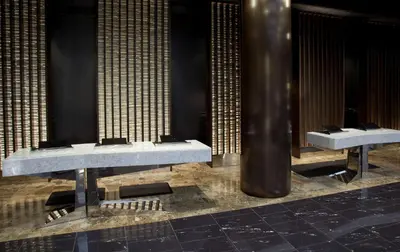 a row of sinks in a room with columns at Hyatt Grand Central New York in New York