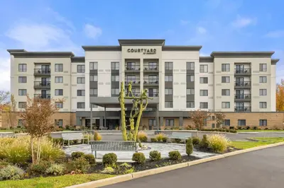 a rendering of the courtyard hotel with a building at Courtyard Philadelphia/Langhorne in Langhorne