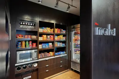 a kitchen with a refrigerator and a microwave at Courtyard Philadelphia/Langhorne in Langhorne