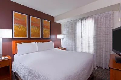 a hotel room with a bed and a television at Residence Inn by Marriott Philadelphia Montgomeryville in North Wales
