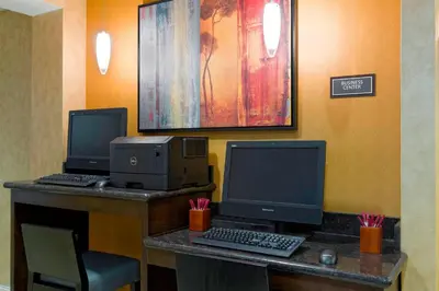 an office with two monitors and a computer on a desk at Residence Inn by Marriott Philadelphia Montgomeryville in North Wales