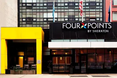 a four points by sheraton sign on a building at Four Points by Sheraton Midtown - Times Square in New York