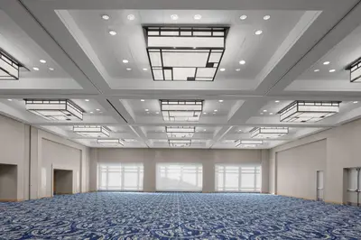 a large empty room with a large ceiling with windows at Hyatt Regency Jersey City on the Hudson in Jersey City