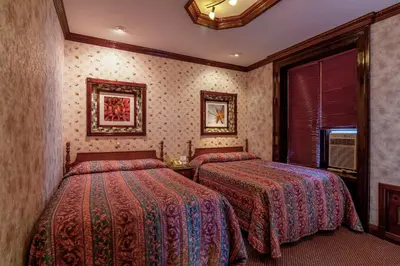 a hotel room with two beds and a window at Hotel 31 Extended Stay in New York