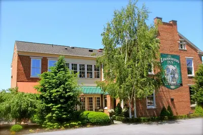 a brick building with a sign on the side of it at The Londonderry Inn in Hershey