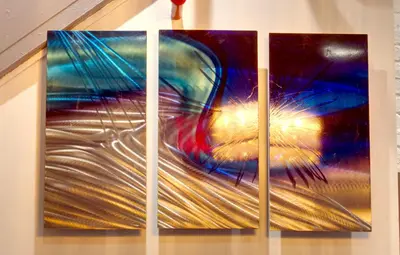a group of four paintings of a face at Chelsea Inn in New York
