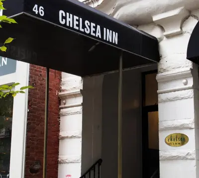 a building with a sign that reads chelsea inn at Chelsea Inn in New York