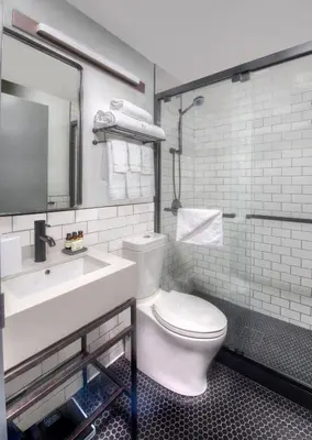 a bathroom with a white toilet and a sink at Citadines Connect Fifth Avenue New York in New York