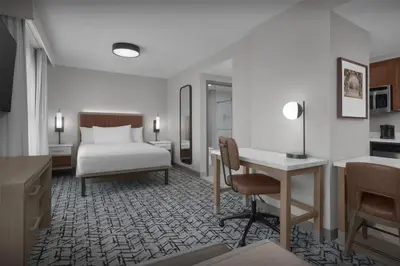 a hotel room with a bed and a desk at Homewood Suites by Hilton Princeton in Princeton