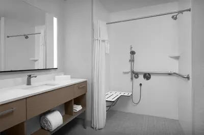 a white bathroom with a sink and a shower at Homewood Suites by Hilton Princeton in Princeton