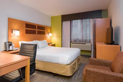 a hotel room with a bed and a desk at Holiday Inn Express - Times Square by IHG in New York