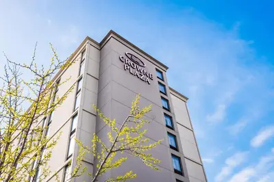 a building with a sign on the top of it at Crowne Plaza Newark Airport by IHG in Elizabeth