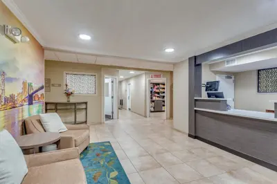 a living room with a couch and a counter at Candlewood Suites Secaucus by IHG in Secaucus