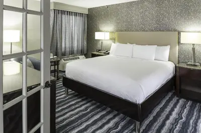 a hotel room with a large bed and a window at DoubleTree by Hilton Hotel Wilmington in Wilmington
