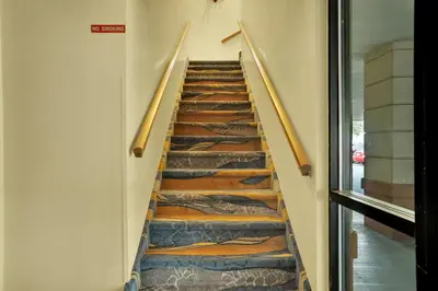 a staircase with wooden treads in a building at Horizon Inn in Avenel