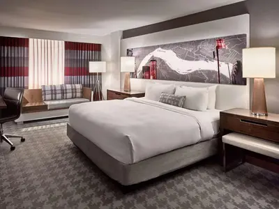a hotel room with a large bed and a desk at Sonesta Philadelphia Rittenhouse Square in Philadelphia
