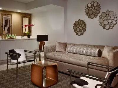 a living room with a couch and some chairs at Sonesta Philadelphia Rittenhouse Square in Philadelphia