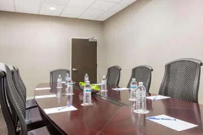 a conference room with a table and chairs with water bottles at Wyndham Philadelphia-Historic District in Philadelphia